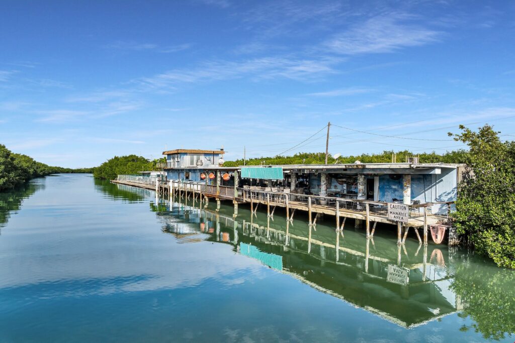 Waterfront view of Alabama Jack’s in North Key Largo with outdoor deck seating