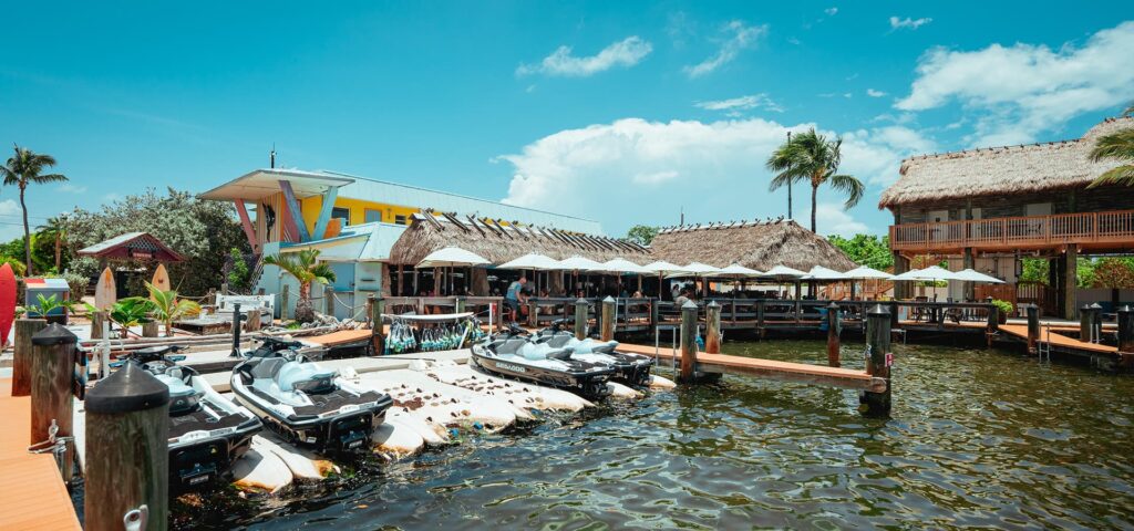 Oceanfront dining at Snappers Restaurant in Key Largo with palm trees and ocean views